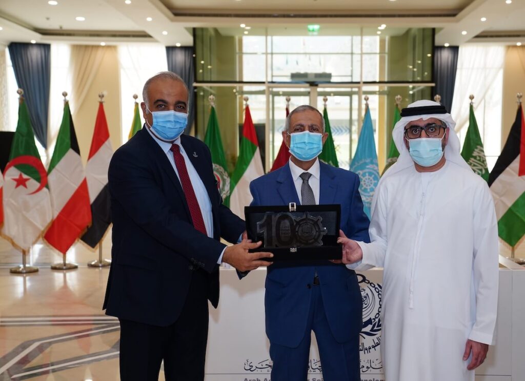Yousif Yacoub Al Mansouri hands the Academy Award to Prof. Dr. Ismail Abdel Ghaffar Ismail Farag, President of the Arab Academy for Science, Technology and Maritime Transport